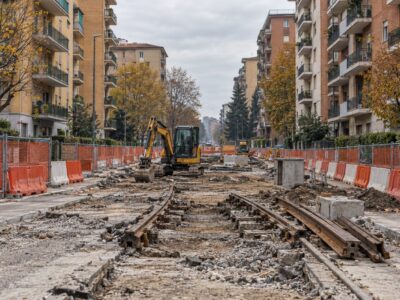 cantiere in via ornato a niguarda con binari del tram rimossi e transenne tra i palazzi del quartiere